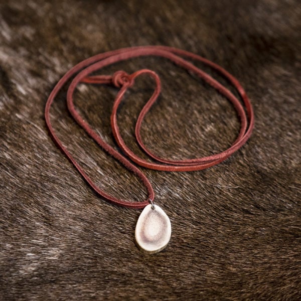 Simple reindeer antler necklace. Leather ribbon, reindeer horn.