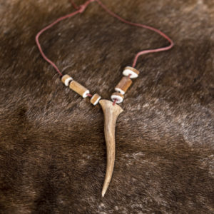 Reindeer bone necklace. Woven leather ribbon 90 cm, reindeer horn.
